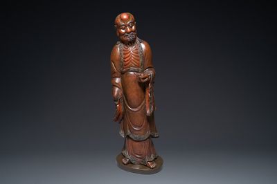 A large Japanese lacquered wooden figure of Daruma, Meiji, 19th C.
