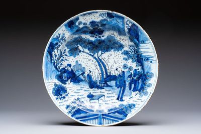 A large manganese, blue and white Dutch Delft chinoiserie dish, 17th C.