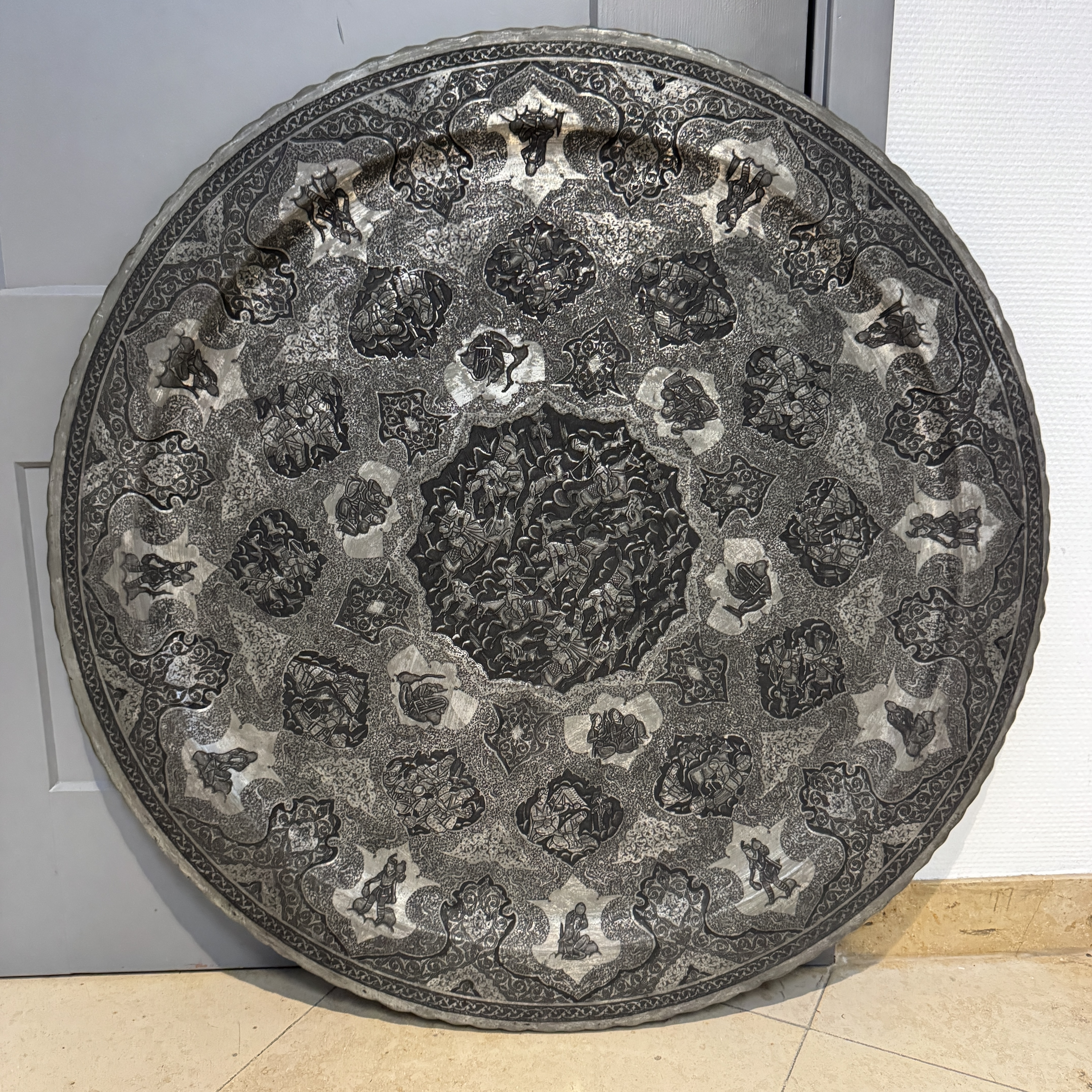 A large Persian engraved tinned-copper dish with narrative design — photo 1