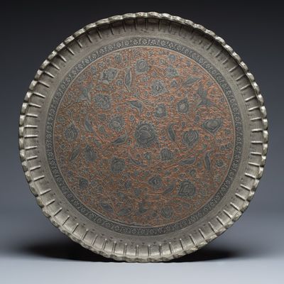 A large Persian engraved tinned-copper tray with birds among flowers, 19/20th C.