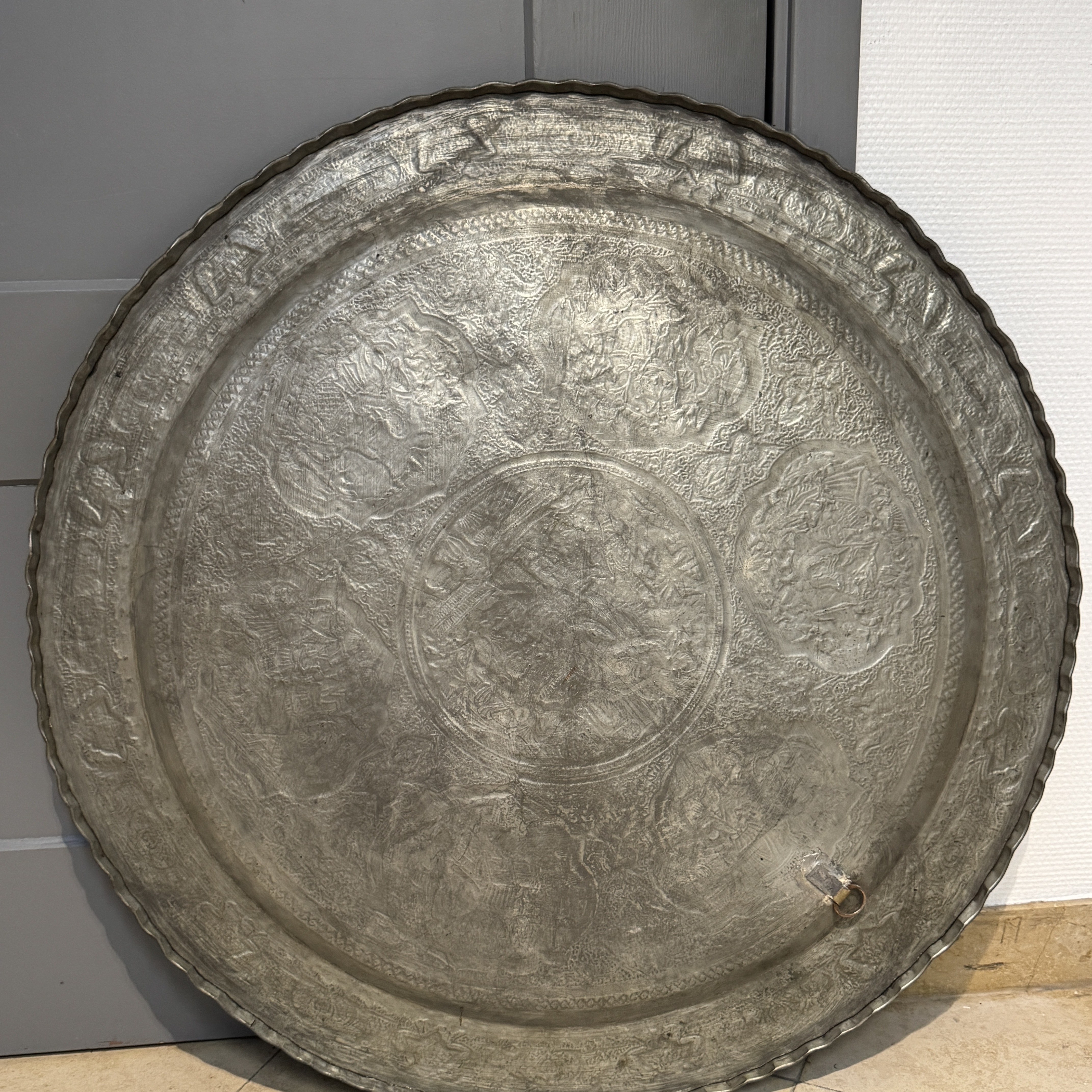 A large Persian engraved tinned-copper tray with narrative design — photo 22