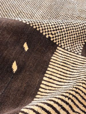 A large Persian hand-knotted woollen carpet with a geometric patchwork design, 20th C. — photo 7