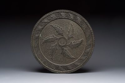 A large Persian reticulated copper-alloy dish with paisley design, Qajar, 19th C.