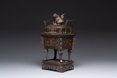 A large Vietnamese copper- and silver-inlaid rectangular 'Buddhist lion' censer and cover on stand, 19th C.