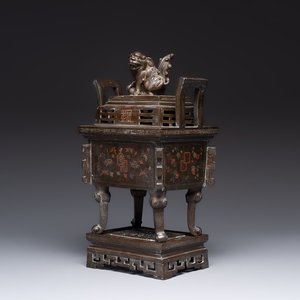 A large Vietnamese copper- and silver-inlaid rectangular 'Buddhist lion' censer and cover on stand, 19th C. — photo 1
