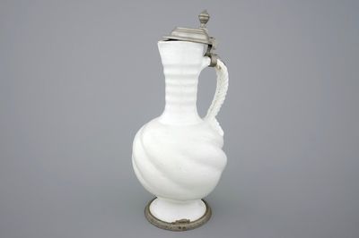 A large white Delft pewter-mounted jug with rope twist handle, 17th C.
