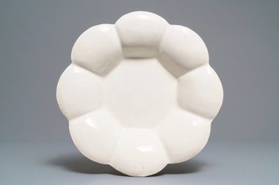 A large white Dutch Delft gadrooned dish, 17th C.