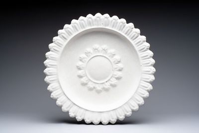 A large white-glazed Delftware 'sunburst' dish, France, 17th C.