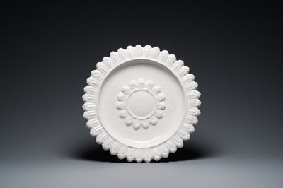 A large white-glazed relief-decorated 'sun' dish, Saint-Jean-du-Désert, Marseille, France, 17th C.