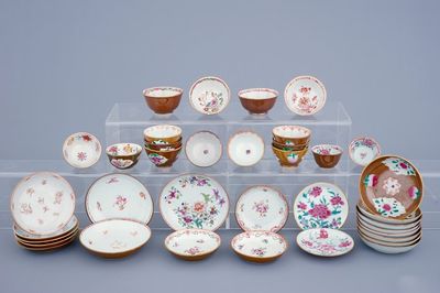 A lot of 16 Chinese famille rose on capucin ground cups and 21 saucers, Qianlong, 18th C.