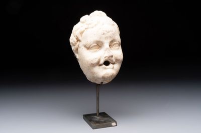 A marble 'putto head' fountain spout, France or Italy, 19th C. or earlier