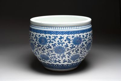 A massive Chinese blue and white 'lotus scroll' fish bowl, Qianlong/Jiaqing
