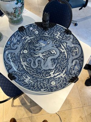 A massive Chinese blue and white reverse-decorated  'dragon' charger with bronze mounts, Chuxiu Gong Zhi mark, Guangxu — photo 1
