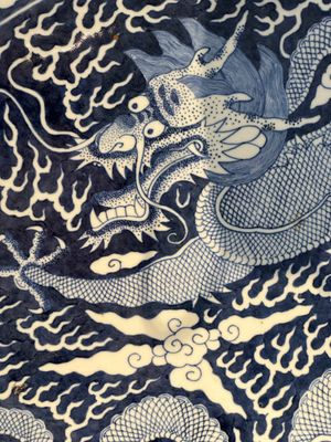 A massive Chinese blue and white reverse-decorated  'dragon' charger with bronze mounts, Chuxiu Gong Zhi mark, Guangxu — photo 11