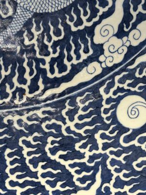 A massive Chinese blue and white reverse-decorated  'dragon' charger with bronze mounts, Chuxiu Gong Zhi mark, Guangxu — photo 19