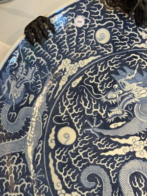 A massive Chinese blue and white reverse-decorated  'dragon' charger with bronze mounts, Chuxiu Gong Zhi mark, Guangxu — photo 3