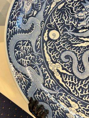 A massive Chinese blue and white reverse-decorated  'dragon' charger with bronze mounts, Chuxiu Gong Zhi mark, Guangxu — photo 4