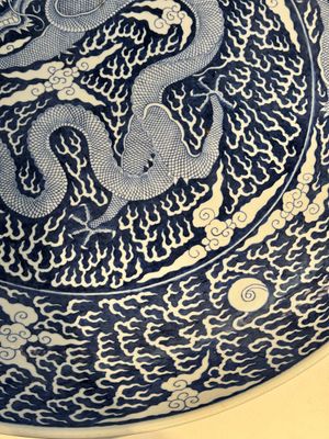 A massive Chinese blue and white reverse-decorated  'dragon' charger with bronze mounts, Chuxiu Gong Zhi mark, Guangxu — photo 5