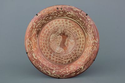 A massive hispano-moresque lusterware dish with a bull, 19th C.