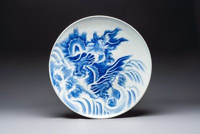 A massive Japanese blue and white 'Dragon among Sea Waves' dish, probably Arita, Meiji, 19th C.