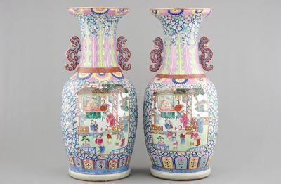 A massive pair of Chinese relief-decorated famille rose porcelain vases, 19th C.