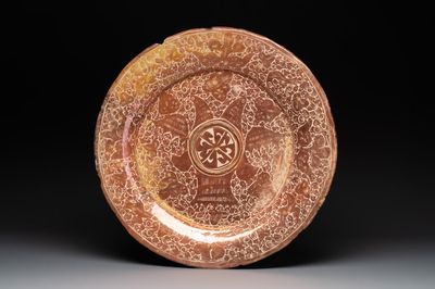 A massive Spanish Hispano-Moresque lustreware 'double eagle' dish, Manises, early 17th C.