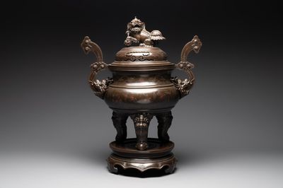 A massive Vietnamese copper- and silver-inlaid 'Buddhist lion' censer and cover on stand, 19th C.