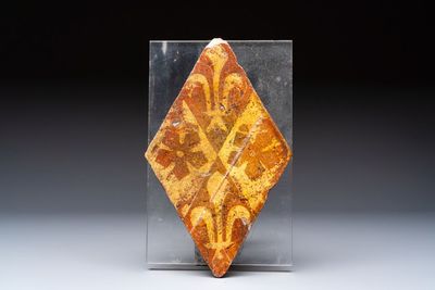 A medieval lozenge-shaped 'Fleur-de-Lys' tile, Chateau de Beauté, France, 14th C.