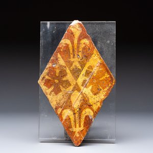A medieval lozenge-shaped 'Fleur-de-Lys' tile, Chateau de Beauté, France, 14th C. — photo 1