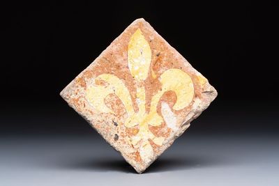 A medieval slip-decorated ‘Fleur-de-Lys’ tile, probably France or Flanders, 14th C.