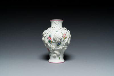 A Mennecy vase with applied floral design, France, DV mark, 18th C.
