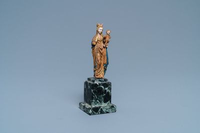 A miniature polychromed and gilded walnut figure of a Madonna with child, so called 'Poupée de Malines', 2nd half 15th. C.