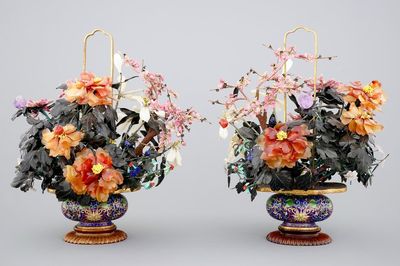 A mirror pair of large jade and precious stone trees in cloisonne vases, early 20th C.