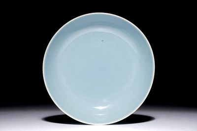 A monochrome Chinese clair-de-lune glazed saucer dish, Qianlong mark, 19/20th C.