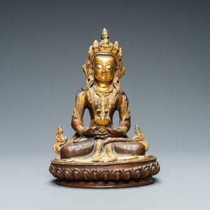 A Nepalese coral- and turquoise-inlaid partly gilded copper alloy figure of Buddha, 19/20th C. — 照片 1