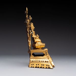 A Nepalese gilt-bronze Buddha on an inscribed throne with a mandorla, 19th C. — photo 6