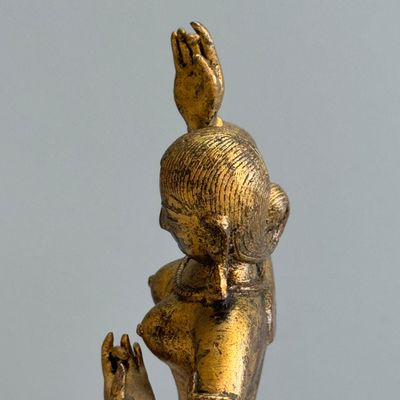A Nepalese gilt-copper alloy figure of a dancing goddess — photo 14