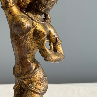 A Nepalese gilt-copper alloy figure of a dancing goddess — photo 3