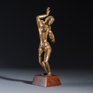 A Nepalese gilt-copper alloy figure of a dancing goddess — photo 1