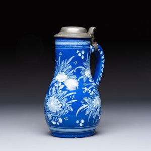 A Nevers white-decorated Persian-blue-ground faience jug with a mounted pewter lid, France, 18th C. — photo 1