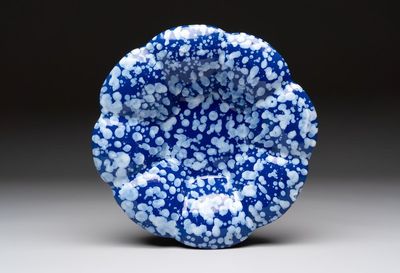 A Nevers white-splashed blue-ground 'à la bougie' dish, France, late 17th C.