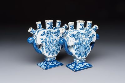 A pair of blue and white Dutch Delft tulip vases with a lady holding a cornucopia, 19th C.