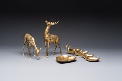 A pair of brass deer sculptures, a leaf-shaped trinket dish and a graduated set of four 'Swan' vide-poches, 20th C.