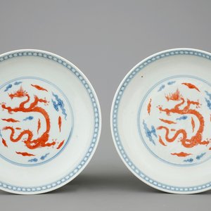 A pair of Chinese blue and white and iron-red dragon plates, Yongzheng mark but prob. 19th C. — photo 1