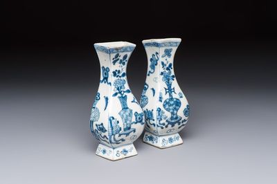 A pair of Chinese blue and white 'Antiquities' wall pocket vases, Kangxi