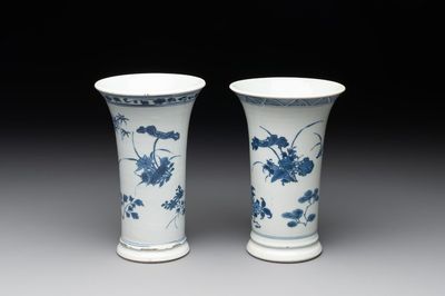 A pair of Chinese blue and white beaker vases with floral sprigs, Transitional period