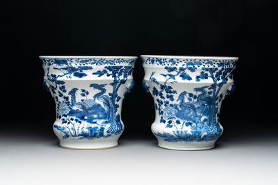 A pair of Chinese blue and white 'birds among flowering branches' jardinières, 19th C.