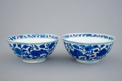 A pair of Chinese blue and white bowls with lions among peony scrolls, late Ming Dynasty