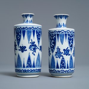 A pair of Chinese blue and white 'Buddhist emblems' rouleau vases, Kangxi — photo 1