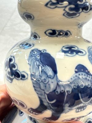 A pair of Chinese blue and white 'Buddhist Lions' triple gourd vases on reticulated wooden stands, 19th C. — photo 33